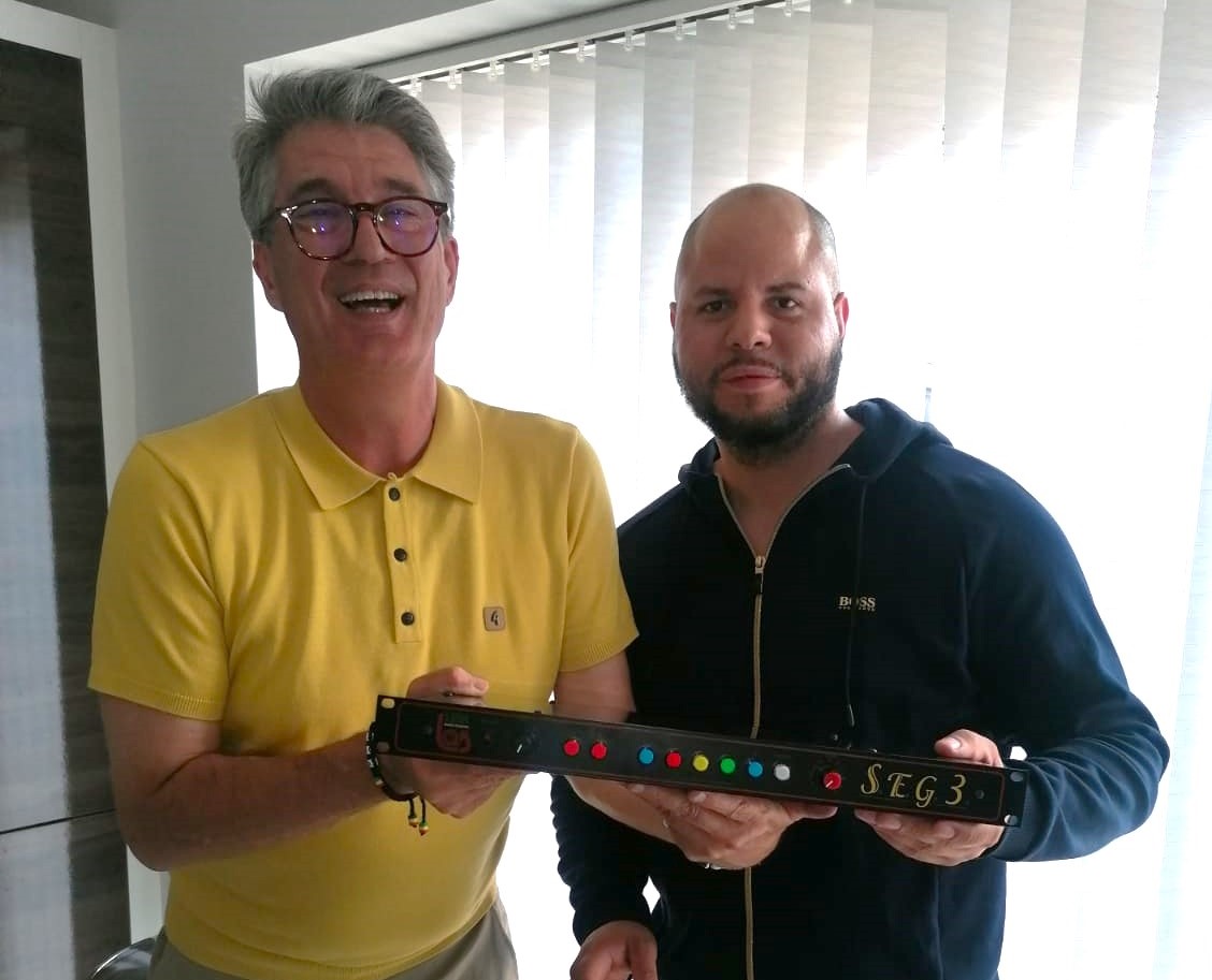 Shaun Gooden (right) posing with a client, holding Links S.E.G 3, featuring RJSPS12A plastic LED push button switches, RJS Electronics LTD